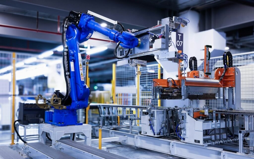 Blue industrial robot arm in a factory