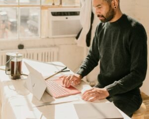 Business owner working on a laptop at a table