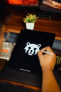 Designer drawing a logo on a tablet