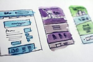 Hand-drawn wireframe sketches of website layouts