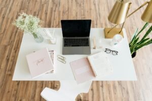 Laptop on a white table in a home office