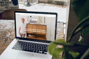 Laptop on a wooden table in daylight