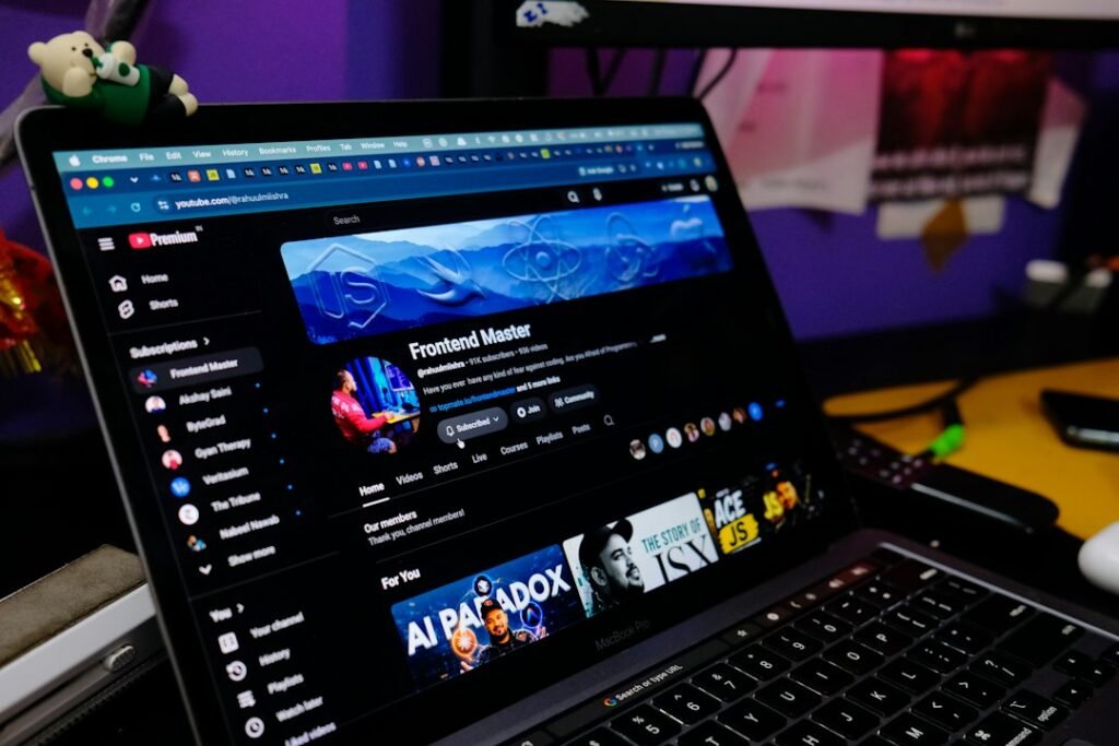 Laptop showing a YouTube channel page, illustrating YouTube automation with AI for creators