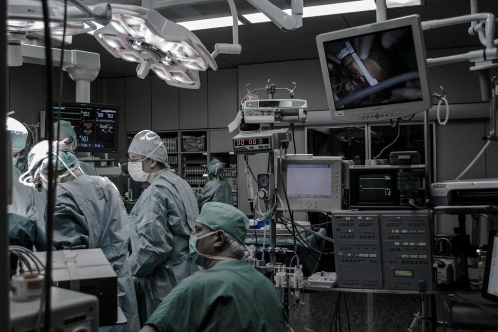Medical team in surgical clothing inside an operating room