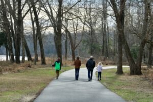 People walking along a path in a park