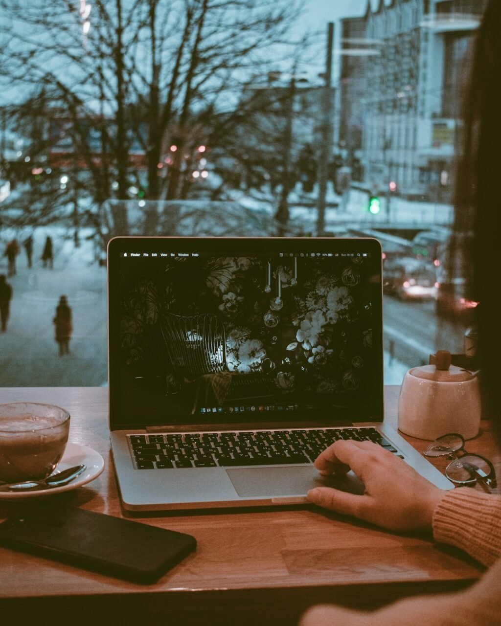 Person working on a laptop at a desk