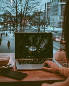 Person working on a laptop at a desk
