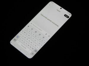 Smartphone showing an AI chat interface, illustrating ChatGPT pricing plans for mobile and web users
