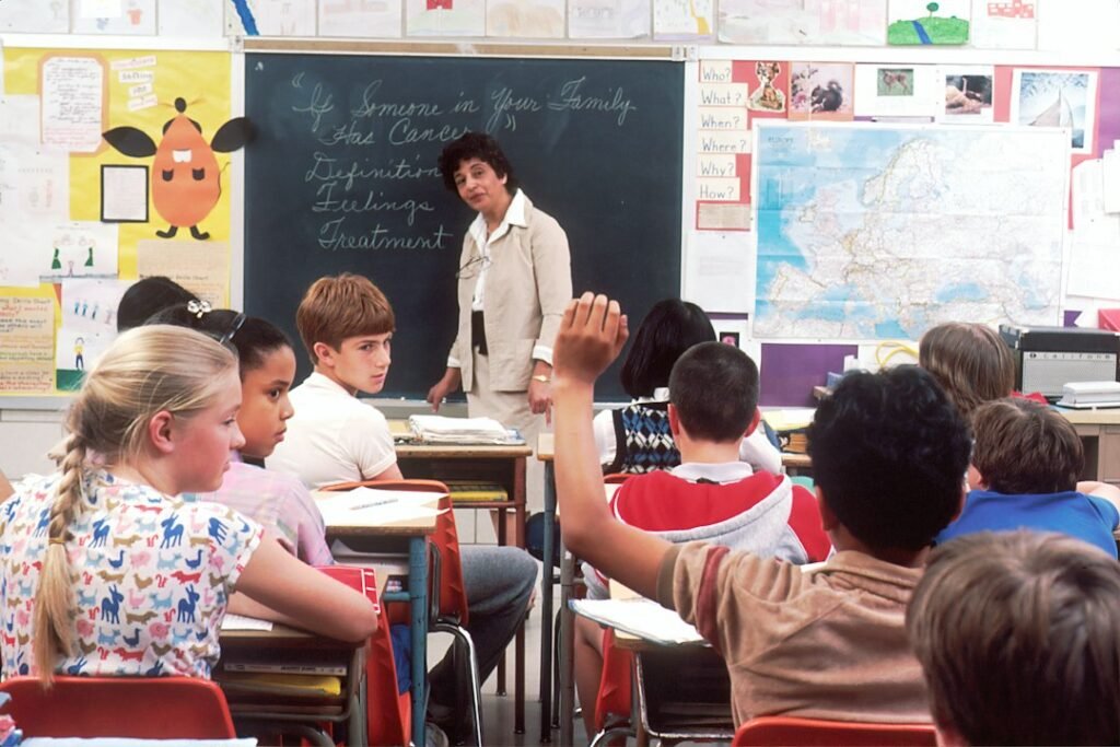 Teacher standing in front of students in a classroom
