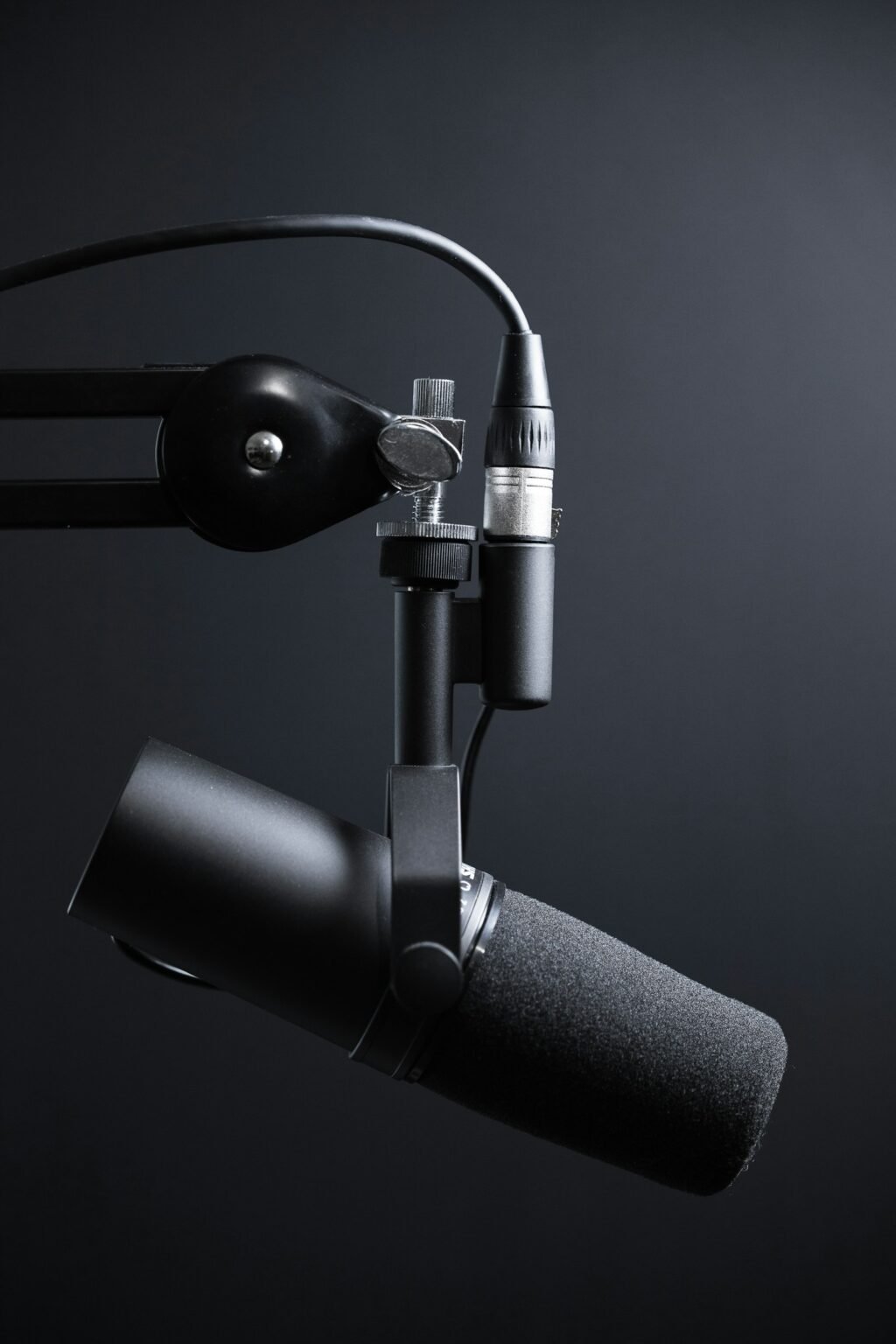 Black and silver studio microphone on a stand, representing ElevenLabs alternatives for AI voice generation