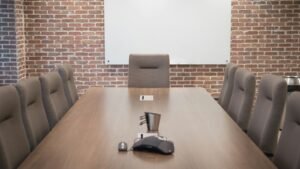 Conference room with a projector screen, representing a Gamma AI review for creating presentations