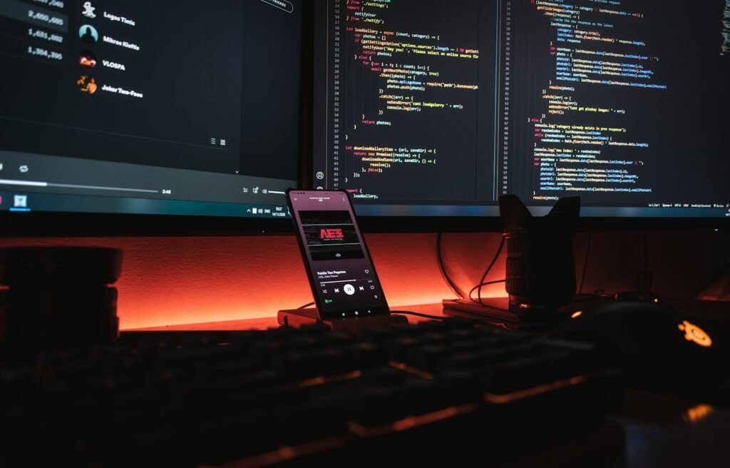 Developer desk with monitors showing code, set up to call the DeepSeek API