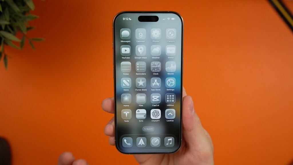 Hand holding an iPhone open to Settings, the starting point to turn off Apple Intelligence