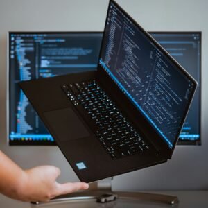 Laptop with code on screen, representing how to install and use Muse Code