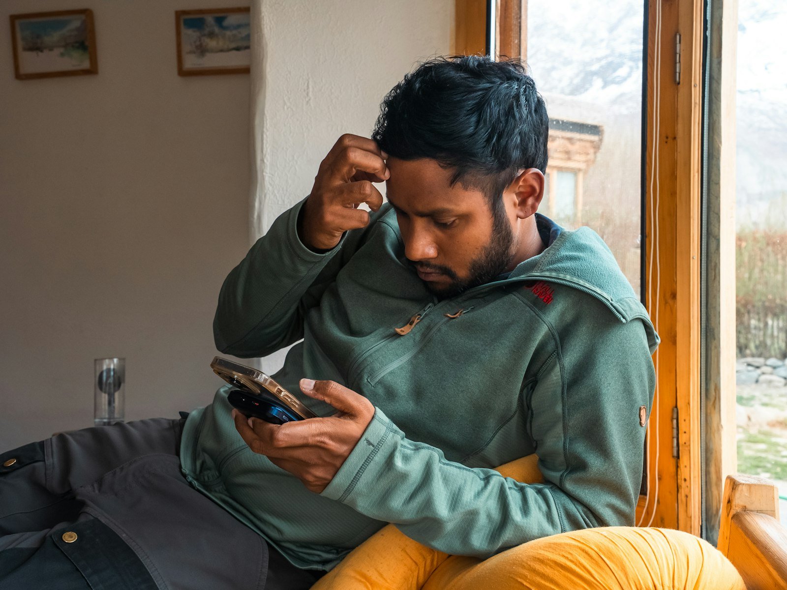 Man looking puzzled at his phone, trying to fix Gemini not working