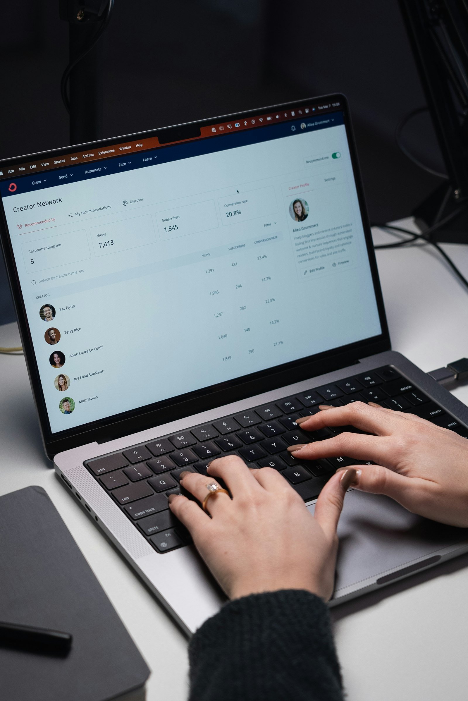 Person typing on a laptop, delegating a task to the Gemini agent from Gmail or Docs