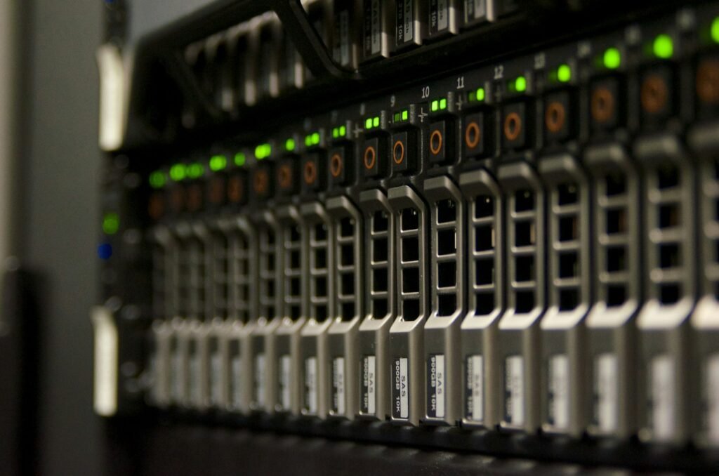 Server rack with green lights, illustrating the hardware needed to run Muse Spark Open