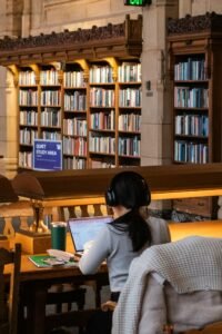 Woman studying in a quiet library, representing NotebookLM alternatives for research and study