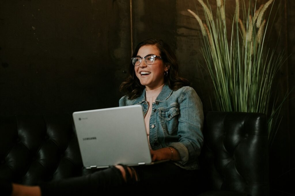Woman using a laptop for a video call, illustrating how to use Tavus AI conversational video
